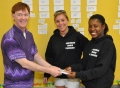 MSO members Rose Albert and Lynsey Wolf present $1,000 in Stop & Shop...