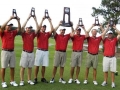 Members of the men's golf team celebrate a second place finish in...