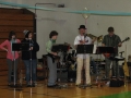 Music professor Gene Nichols, second from right, leads a student rock...
