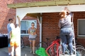 Students are hard at work painting our brand new bike shelter behind...